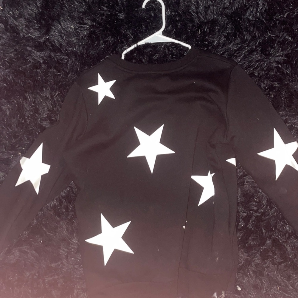 Black sweater with star print